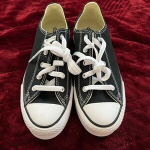 Classic Converse Black and White Chuck Taylor sneakers.